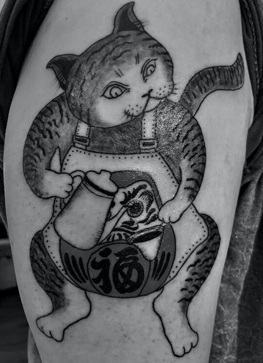 BARISTA CAT UPPER ARM TATTOO