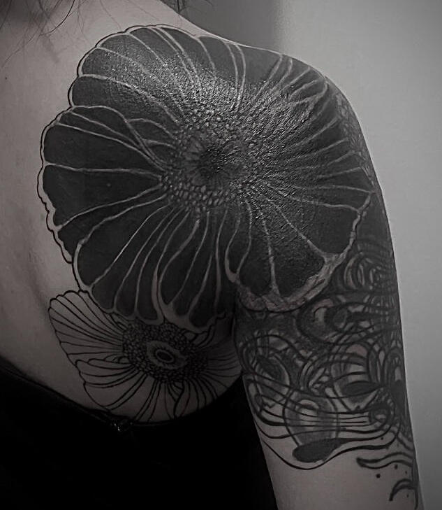 BLACK FLORAL AND WAVES COVER UP TATTOO ON SHOULDER AND UPPER ARM